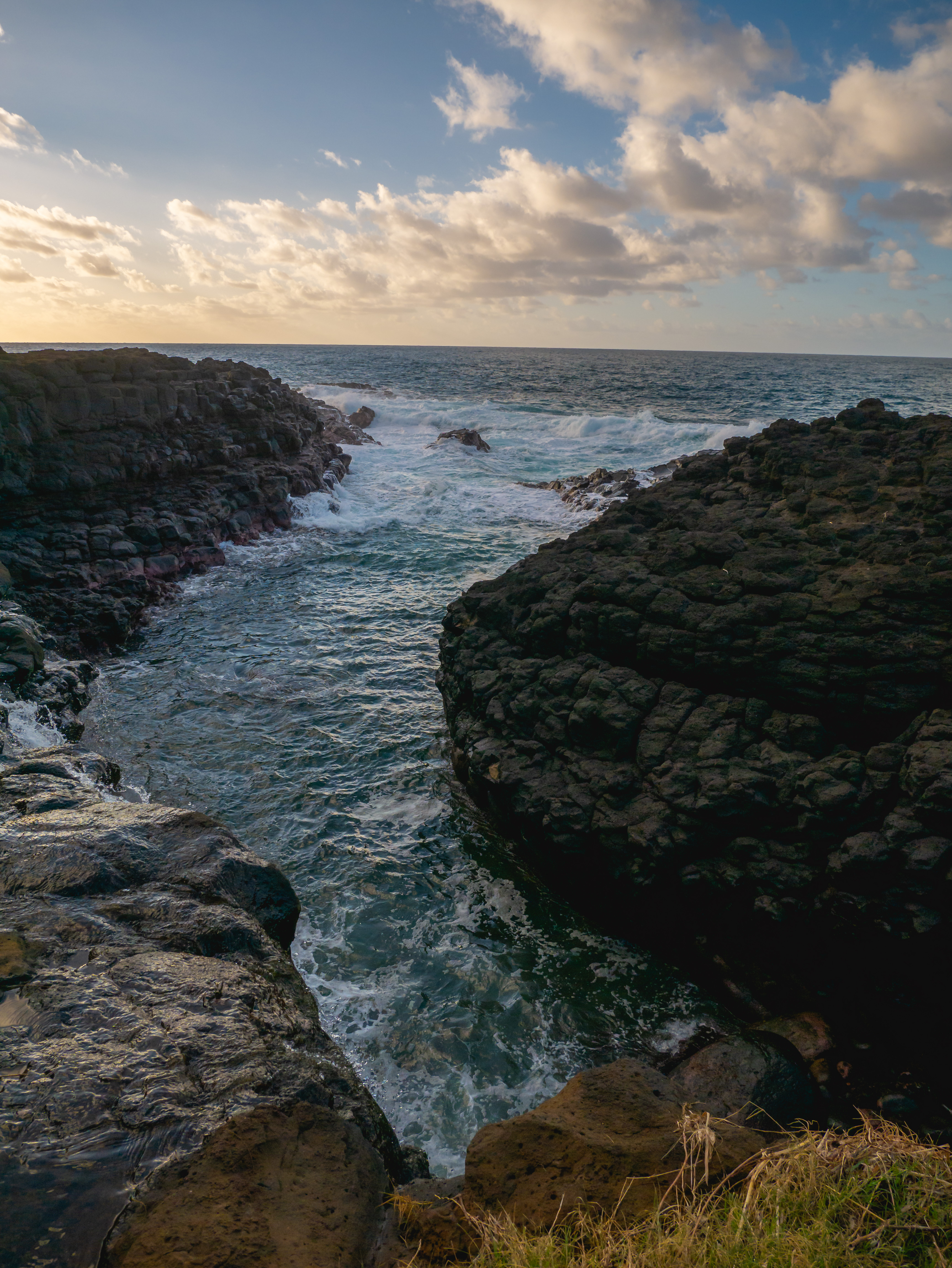 Pacific Ocean sunset looking over Queen's Bath in Princeville, HI on the island of Kauai